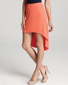 Slip into a coral Volcom skirt and head poolside in sunny summer style--you're all the rage when you team it with a tissue-thin tee and strappy sandals.