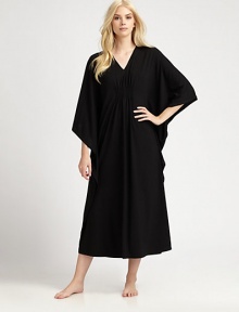 An elegant design with a gathered front and ruffled sides for comfortable, yet sophisticated look. V-neckThree-quarter length kimono sleevesGathered frontRuffled sidesPull-on styleAbout 50 from shoulder to waist67% polyester/33% rayonMachine washImported An elegant design with a gathered front and ruffled sides for comfortable, yet sophisticated look. V-neckThree-quarter length kimono sleevesGathered frontRuffled sidesPull-on styleAbout 50 from shoulder to waist67% polyester/33% rayonMachine washImported