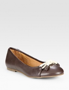 Burnished leather classic enhanced by a unique rope bow adornment and padded insole. Leather and rope upperLeather liningRubber solePadded insoleImported Burnished leather classic enhanced by a unique rope bow adornment and padded insole. Leather and rope upperLeather liningRubber solePadded insoleImported