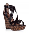 With a retro edge and modern-approved styling, these Marc by Marc Jacobs platforms add a fashion-forward accent to your day or night look - Woven-detailed chunky platform wedge heel, front crisscross straps, ankle buckle closure - Wear with high-waisted flared jeans, a high/low hem blouse, and a boyfriend cardigan for pared-down chic