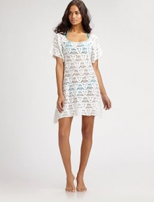 A delicately designed coverup with a flattering square neckline. Square neckShort sleevesMacrame detailPull-on styleAsymmetrical hemRayonHand washImported A delicately designed coverup with a flattering square neckline. Square neckShort sleevesMacrame detailPull-on styleAsymmetrical hemRayonHand washImported