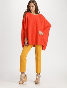 This luxuriously oversized knit drapes around the body in a crossover-back silhouette.BoatneckDropped shouldersDolman sleevesRibbed cuffsRibbed hemAbout 29 from shoulder to hem40% wool/28% viscose/15% polyamide/10% cashmere/7% angoraDry cleanImportedModel shown is 5'9 (175cm) wearing US size Small.