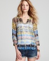 A vibrant tribal print shirt from Plenty by Tracy Reese shows off your boho-chic side-summer sensational with jean shorts or belted over a flowing maxi skirt.