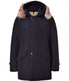 Designed by Yoshida Tokihito as a modern interpretation of the forever favorite Arctic parka, Woolrichs Polar parka is a must for contemporary cool weather looks - Hood with coyote fur trim, long sleeves, buttoned tabbed cuffs, hidden two-way front zip, button placket, buttoned front flap and slit pockets, tonal elbow patch detail - Contemporary fit, slightly fitted waist - A versatile, classic coat perfect for both city streets and country slopes