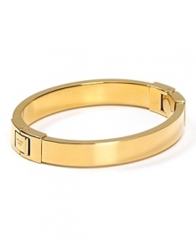 A subtle touch of shine, MICHAEL Michael Kors' gold bangle defines versatile. Wear the shapely hinged style to add a silvery polish to any outfit. A subtle touch of shine, MICHAEL Michael Kors' gold bangle defines versatile. Wear the shapely hinged style to add a silvery polish to any outfit.