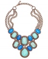 It's called the show stopper for a reason. Monet's look-at-me now style highlights reconstituted turquoise, blue stones, and cubic zirconia accents. Set in trendy bronze tone mixed metal. Approximate length: 16 inches + 3-inch extender. Approximate drop: 3-3/4 inches.