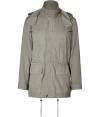 Stylish fatigue green textured cotton parka from Marc by Marc Jacobs - Add instant casual-cool to your cold weather looks with this classic parka - Slim silhouette with a drawstring waist and flap pockets - Style with cargo pants, a long sleeve henley, and trainers