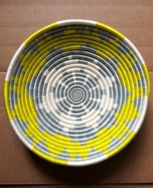 Hope shines among Rwanda's women artisans and in the vivid sun-yellow and slate-blue pattern that distinguishes this handcrafted basket. Filled with fruit or simply accenting a wall, it serves as daily inspiration for women everywhere. Hope shines among Rwanda's women artisans and in the vivid sun-yellow and slate-blue pattern that distinguishes this handcrafted basket. Filled with fruit or simply accenting a wall, it serves as daily inspiration for women everywhere.