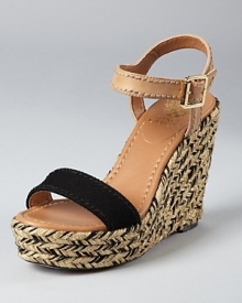 Black, tan and detailed all over, these VINCE CAMUTO wedges have a lot to love. Stitching details at the ankle strap lend a unique touch, while a braided wedge infused with metallic shimmer makes the shoe all-out covetable.