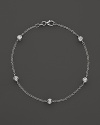 Diamond stations on a fine white gold chain bracelet.