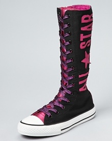 An ultra-high top version of a Converse classic, the All Star, this canvas boot makes a bold statement with large logo lettering and rasberry rose metallic laces. An ultra-high top version of a Converse classic, the All Star, this canvas boot makes a bold statement with large logo lettering and rasberry rose metallic laces.