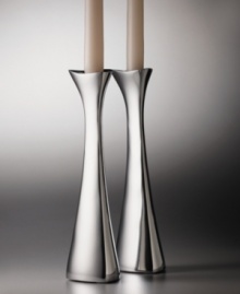 One of Nambe's most popular designs, the Tri-Corner candlesticks were designed by sculptor, Richard K. Thomas. These candlesticdks embody Nambe's guiding principles of design: objects for the home that are functional, as well as beautiful. An asymmetrical shape and high-polished metal combine to lend your home modern elegance.