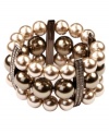 Chocolate chic. Givenchy's glamorous three-row bracelet features blush and cocoa-colored glass pearls with crystal-encrusted spacers. Set in brown gold-plated mixed metal. Approximate diameter: 2-1/8 inches.