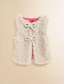 A textural vest with cozy faux-fur, a silky contrast lining and bow details at the front closures.SleevelessOpen front with double hook-and-eye closureFully lined76% modacrylic/24% polyesterMachine washImported A textural vest with cozy faux-fur, a silky contrast lining and bow details at the front closures.SleevelessOpen front with double hook-and-eye closureFully lined76% modacrylic/24% polyesterMachine washImported