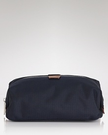 Jack Spade offers up a minimalist dopp kit with a zip top, leather details and interior zip compartments to store all of your travel toiletries. Jack Spade offers up a minimalist dopp kit with a zip top, leather details and interior zip compartments to store all of your travel toiletries.