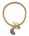 A sparkling watermelon charm on chainlink bracelet with toggle closure from Juicy Couture.