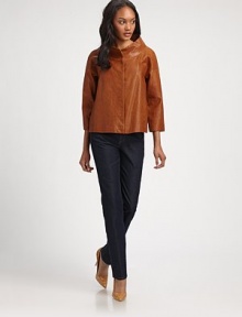 A decidedly modern interpretation of a timeless silhouette. This jacket is made from butter-soft Italian leather for an amazingly fashion-forward look.Stand collarThree-quarter sleevesConcealed snap frontFully linedAbout 22 from shoulder to hemLambskin leatherDry clean by leather specialistImported of Italian fabric Model shown is 5'10 (177cm) wearing US size Small. A decidedly modern interpretation of a timeless silhouette. This jacket is made from butter-soft Italian leather for an amazingly fashion-forward look.Stand collarThree-quarter sleevesConcealed snap frontFully linedAbout 22 from shoulder to hemLambskin leatherDry clean by leather specialistImported of Italian fabric Model shown is 5'10 (177cm) wearing US size Small.