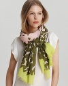 A sheer oblong scarf with a painterly animal print and neon border ends.