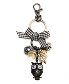 Wise and witty. A whimsical owl with googly eyes delightfully decorates this key chain from Betsey Johnson. Featuring a heart and arrow charm, floral accents and a gingham ribbon, it's detailed with glittering crystals. Made in mixed metal. Comes with a gift box. Approximate length: 5-3/4 inches.