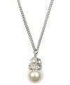 Simplicity and subtlety combine. This effortlessly gorgeous Givenchy necklace highlights a polished glass pearl (10 mm) and sparkling crystals set in silver tone mixed metal. Approximate length: 18 inches. Approximate drop: 1 inch.