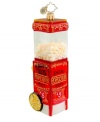 Skip popcorn balls and garland for an ornament that's literally popped to perfection. Advertising the hot, fresh movie theater favorite, it's hard to believe the vintage-style cart is handcrafted in pure glass. By Christopher Radko.