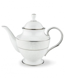 This elegant teapot is accented with a delicate flourish of vine-like, white-on-white imprints with raised, iridescent enamel dots. Holds 40 oz. From Lenox's dinnerware and dishes collection. Qualifies for Rebate This elegant teapot is accented with a delicate flourish of vine-like, white-on-white imprints with raised, iridescent enamel dots. Holds 40 oz. From Lenox's dinnerware and dishes collection. Qualifies for Rebate