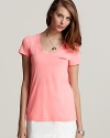 Shift your look from neutral to neon in this bold Theory top, driving weekend looks home with high-powered style.