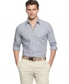 Square off with this streamlined fitted button-front shirt from Tasso Elba.