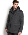 Wrap yourself in warmth and class with this wool-blend hooded coat from Calvin Klein.