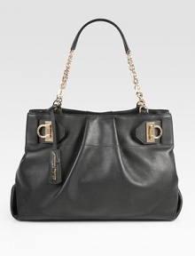 Ultra-luxe Italian leather with delicate pleats and cinching at the sides, adorned with a gleaming chain strap. Double chain shoulder straps, 8½ dropMagnetic snap closureProtective metal feetOne inner zip compartmentOne inside zip pocketTwo inside open pocketsFully lined15W X 10½H X 5½DMade in Italy Ultra-luxe Italian leather with delicate pleats and cinching at the sides, adorned with a gleaming chain strap. Double chain shoulder straps, 8½ dropMagnetic snap closureProtective metal feetOne inner zip compartmentOne inside zip pocketTwo inside open pocketsFully lined15W X 10½H X 5½DMade in Italy
