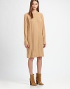Silky crepe, tailored in a loose-fitting silhouette accented with crisp pleats.Jewel necklineFront pleatsLong sleeves with button cuffsInverted back pleatConcealed back zipFully linedAbout 24 from natural waist54% acetate/46% viscoseDry cleanImportedModel shown is 5'10 (177cm) wearing US size 4. 
