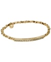 Stackable styles a must! Michael Kors' chic stretch bracelet pairs perfectly with bangles or bracelets. Beads and bar accent are crafted in gold tone mixed metal and accented by pave-set glass accents. Approximate diameter: 2-1/4 inches. Approximate width: 1/8 inch.