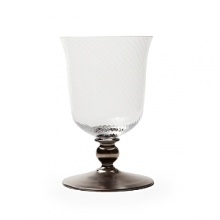 Mouth-blown by artisans in the hills outside Prague, this faceted goblet sits atop a regal hand-painted platinum stem. Mouth-blown by artisans in the hills outside Prague, this faceted goblet sits atop a regal hand-painted platinum stem.