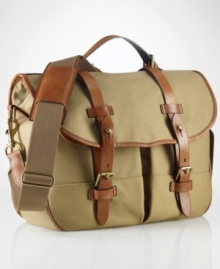 The iconic messenger bag is granted laid-back luxury from a burnished saddle-leather double-buckle closure and embossed signature leather luggage tag for a sharp finish. The iconic messenger bag is granted laid-back luxury from a burnished saddle-leather double-buckle closure and embossed signature leather luggage tag for a sharp finish.