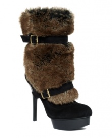 Bring the drama. Bold and beautiful, the Chandra boots from GUESS by Marciano are wonderfully wild - and warm - with a faux fur shaft wrapped with buckles.