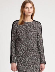 A classic tweed design with a modern, cropped silhouette and solid trim.Round neckSolid trim along sleevesButton frontAbout 22 from shoulder to hem41% polyester/19% polyurethane/18% acrylic/17% wool/5% polyamideDry cleanMade in ItalyModel shown is 5'10½ (179cm) wearing US size 4. 