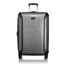 This lightweight, hardside case is ideal for longer trips or two traveling together. Among the many technological and functional advancements of Tegra-Lite™ is Tumi's patented X-Brace 45™ handle system that adds structural rigidity to the case and prevents damage to the handle. The case is lined and features interior accessory pockets and tie-down straps, a removable garment sleeve, TSA integrated locks and exterior bumpers for added protection. A four-wheel system offers incredible maneuverability. This lightweight, hardside case is ideal for longer trips or two traveling together. Among the many technological and functional advancements of Tegra-Lite™ is Tumi's patented X-Brace 45™ handle system that adds structural rigidity to the case and prevents damage to the handle. The case is lined and features interior accessory pockets and tie-down straps, a removable garment sleeve, TSA integrated locks and exterior bumpers for added protection. A four-wheel system offers incredible maneuverability.