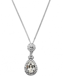 Add glamour to any look with Givenchy's stunning teardrop pendant. Crafted in silver tone mixed metal, round and pear-cut crystals create a shimmering effect. Approximate length: 16 inches + 2-inch extender. Approximate drop: 1-1/2 inches.