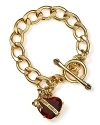 Have a heart. Juicy Couture's gold-plated link bracelet is a charming starter, best when decked with couture tokens.