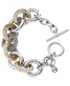 Opposites attract. Michael Kors trendy toggle bracelet will appeal to your organic side, and your glam side with its unique blend of acetate horn and glass-accented links. Set in silver tone mixed metal. Approximate length: 8-1/2 inches. Approximate width: 3/4 inch.