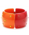 Stir up your look with a citrus splash! Haskell's retro-chic style features a half and half design of fuchsia and orange with matching round-cut crystals. Set in mixed metal. Bracelet has an easy-to-use hinge clasp. Approximate diameter: 2-1/2 inches.