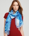 A sheer oblong scarf with a cool blue hues in an abstract print.