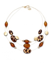 Perfect for prowling. Let your wild side shine in Style&co.'s subtle illusion necklace. Brown, gold, and leopard print beads are strung from three delicate chains. Crafted in gold tone mixed metal. Approximate length: 20 inches + 2-inch extender. Approximate drop: 2-1/2 inches.