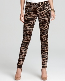 Send your style on an exotic quest with these zebra-print Michael Kors skinny pants. Elevate the look with sleek heels and golden accents for untamed glamour.