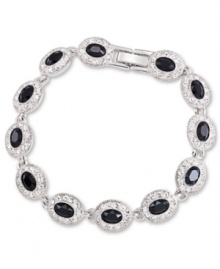 Black is back and extra glam with the Carolee flex bracelet. Crafted from silver-tone mixed metal, the bracelet features black glass stones adorned in sparkling accents. Approximate length: 7 inches.