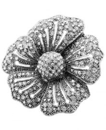 Burst onto the style scene with a sparkling cocktail ring. GUESS's chic style features a full-bloom flower accented by sparkling round-cut crystals. Set in silver tone mixed metal. Ring stretches to fit finger.