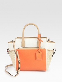 Colorblocked top-handle design of smooth glovetan leather and super-chic canvas. Double top handles, 4¼ dropRemovable, adjustable shoulder strap, 21-22½ dropFront pocket with removable zip pouchTwo open side pocketsBack slide pocketTwo inside zip pocketsInner zip pouchCotton lining9¾W X 9½H X 4¾DImported Colorblocked top-handle design of smooth glovetan leather and super-chic canvas. Double top handles, 4¼ dropRemovable, adjustable shoulder strap, 21-22½ dropFront pocket with removable zip pouchTwo open side pocketsBack slide pocketTwo inside zip pocketsInner zip pouchCotton lining9¾W X 9½H X 4¾DImported