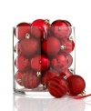 A favorite from one year to the next, Kurt Adler's shatterproof ball ornaments mix stripes and swirls of glitter with matte and shiny finishes, all in festive holiday red.