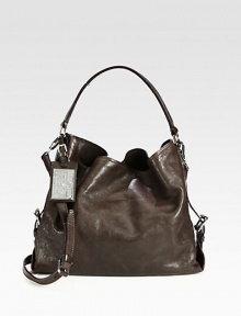A roomy leather carryall in a classic shape with a versatile detachable strap.Top handles, 9½ dropDetachable adjustable shoulder strap, 21½-22½ dropMagnetic snap closureThree inner compartmentsTwo inside zip pocketTwo inside open pocketsCotton lining14½W X 11H X 6DMade in Italy A roomy leather carryall in a classic shape with a versatile detachable strap.Top handles, 9½ dropDetachable adjustable shoulder strap, 21½-22½ dropMagnetic snap closureThree inner compartmentsTwo inside zip pocketTwo inside open pocketsCotton lining14½W X 11H X 6DMade in Italy