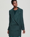 Tibi's classic car coat lends a timeless look for the season in a double breasted, must-have silhouette.